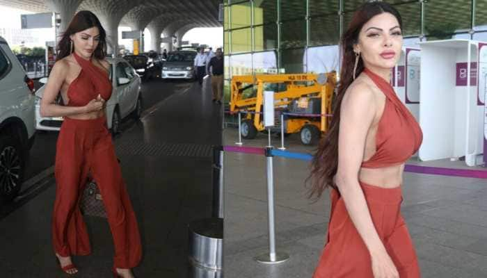 Sherlyn Chopra Suffers Oops Moment At Airport, Covers Up Her Criss-Cross Halter Backless Top As Paps Click Her - Watch