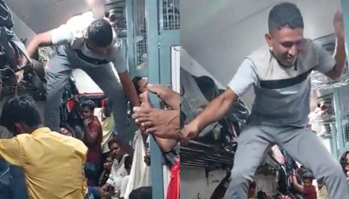 Man’s Gymnastics To Travel Through Crowded Train Compartment Divide Twitter