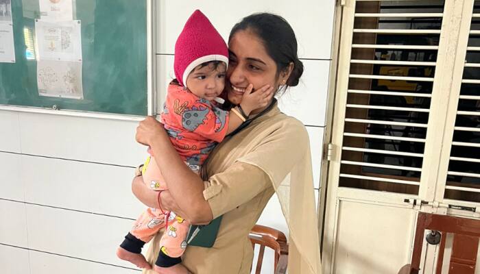 Gujarat Police Woman Constable Looks After Baby While Mother Sits For Exam