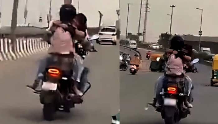 Couple Romances On Moving Bike In Delhi, Gets ‘11000 Ka Shagun’ From Police - Watch