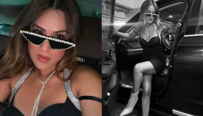 Nia Sharma Turns Heads In Plunging Black Dress, Wears Disco Sunglasses - Watch