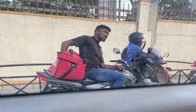 WATCH: Zomato Delivery Guy Seen Eating Customer's Food At Traffic Signal In Bengaluru