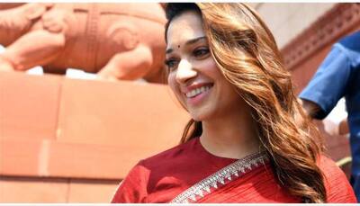 Tamannaah Bhatia Glows In Regal Red Saree On Her Visit To New Parliament