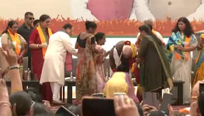 PM Modi Touches Feet Of BJP Women Cadres Who Felicitated Him For Reservation Bill