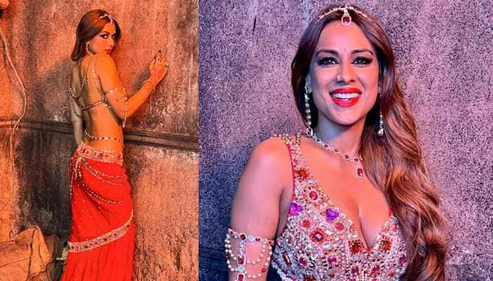 &#039;Naagin&#039; Nia Sharma Oozes Oomph In Red Hot Desi Attire, Flaunts Her Toned Midriff As &#039;Suhaagan Chudail&#039; - Watch