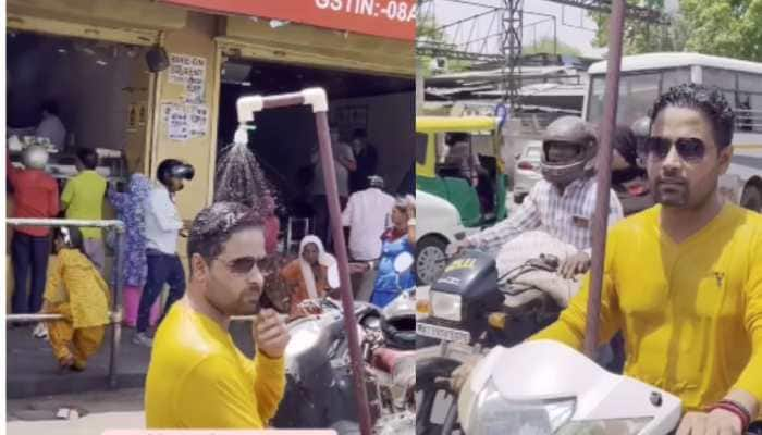 Shocking ! Man Installs Shower On Motorbike to Beat Blazing Hot Weather; Video Viral