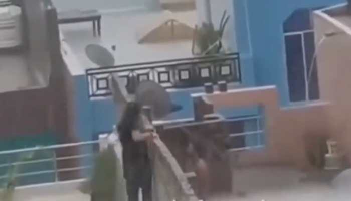 &#039;Barish Ka Sahi Istemal&#039;: Video Of Couple Romancing Secretly On Roof During Rain Goes Viral; Watch