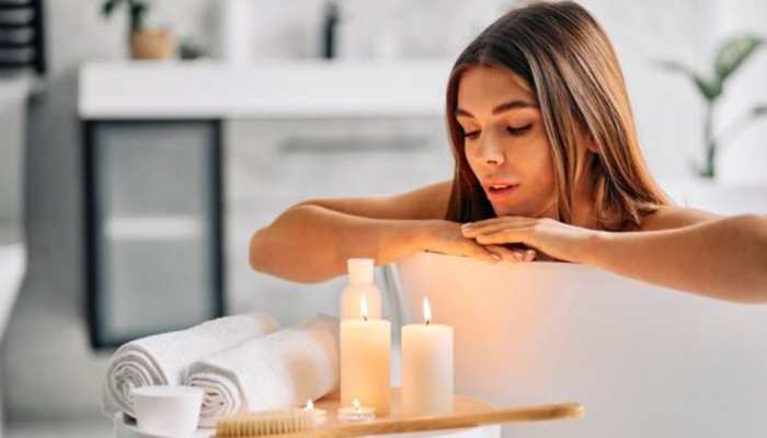 What Is The Candle Moisturizer Trend? Understanding The Risks Of This Viral Beauty Hack