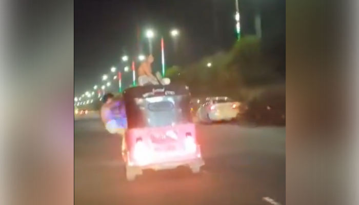 Watch: Shirtless Men Perform Stunts on Pink Auto On Noida Expressway 