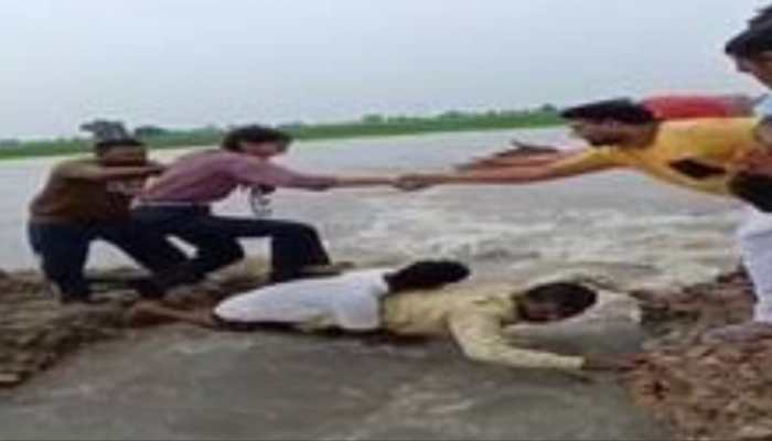 Human Bridge In Punjab: Two Men Brave Floods To Rescue 35 Children, Video Goes Viral | WATCH