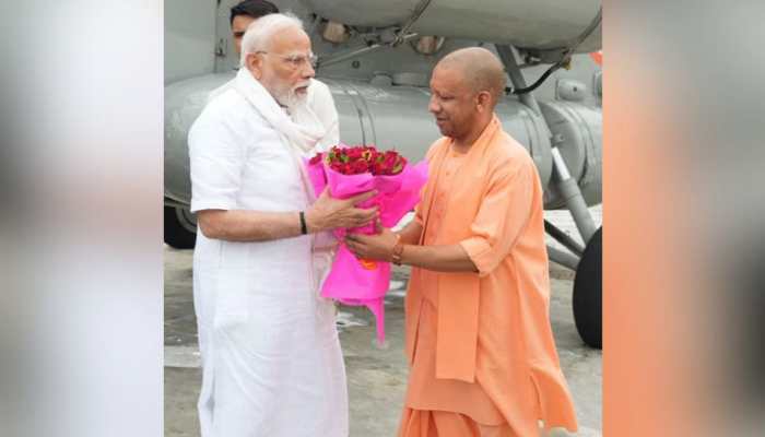 Video: CM Yogi Welcomes PM Narendra Modi Upon His Arrival In Varanasi Video: CM Yogi Welcomes PM Narendra Modi Upon His Arrival In Varanasi
