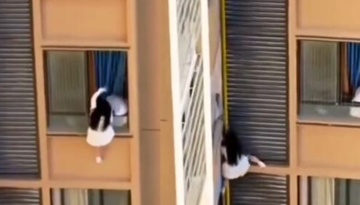Dangerous Love: Woman Dangles From High-Rise To Escape Lover’s Wife - Watch