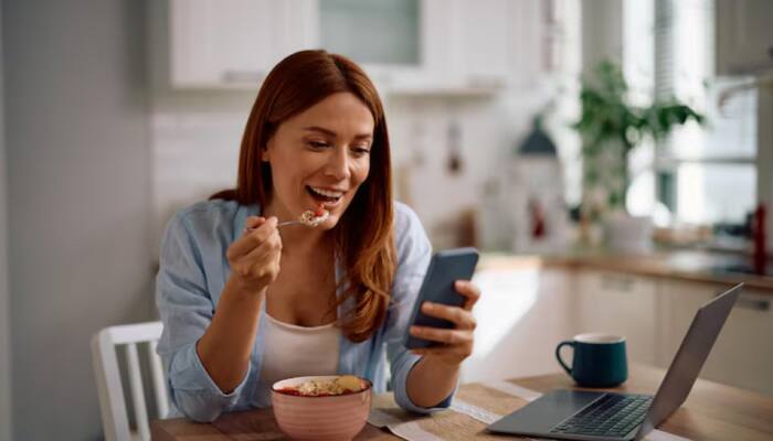 Doomscrolling On Social Media While Eating Could Be Making You Fat, How Mindless Eating Impacts Your Waistline