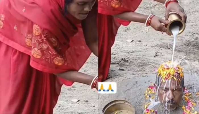 Pati Parmeshwar? Woman buries husband to the neck, performs pooja on his head