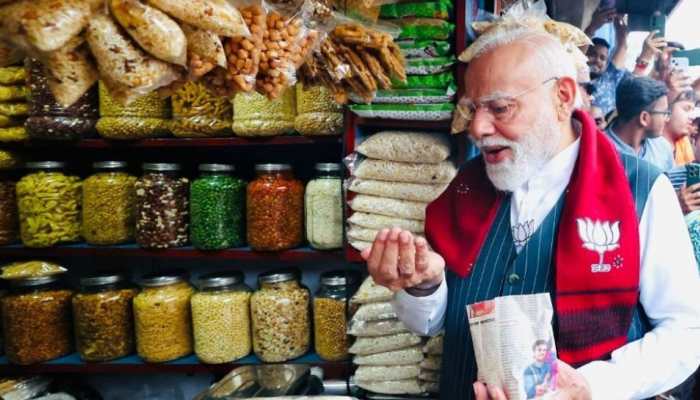 On Bengal campaign trail, PM Modi stops for popular street snack 'jhalmuri'