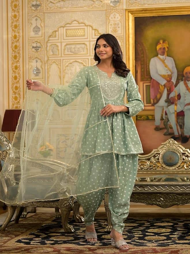 Stylum Women’s Bandhani Printed & Embroidered Rayon Pleated Kurti with Dhoti Pant & Dupatta Set Stylum Women’s Bandhani Printed & Embroidered Rayon Pleated Kurti with Dhoti Pant & Dupatta Set